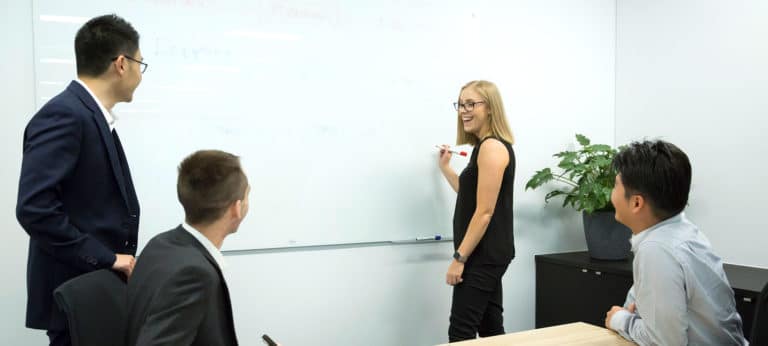 QMetrix team members meeting and enjoying a discussion